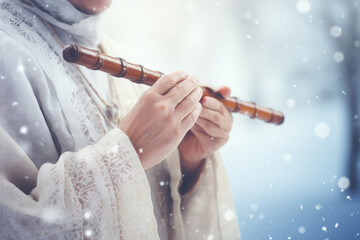 Winter Flute Melody - A close-up of hands playing a wooden flute, snowy backdrop - AI Generated