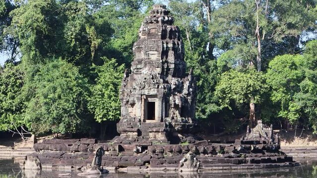 Neak Pean (or Neak Poan) at Angkor, Cambodia is an artificial island with a Buddhist temple on a circular island in Jayatataka Baray.