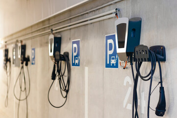 Charging Station for Electric Cars in Private Garage of Multifamily Building. Autonomous Refueling...