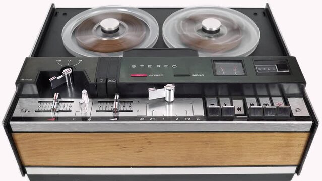 Rewinding the Magnetic Tape of an Old Tape Recorder.
