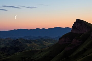 Fototapeta na wymiar crescent moon between two hill peaks