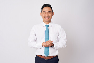 Smiling happy Asian businessman wearing formal shirt and tie standing confident while showing welcome gesture with hands isolated on white background