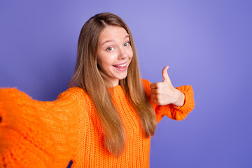 Selfie cadre of smiling happy teenage girl showing like symbol thumb up spend halloween holiday...