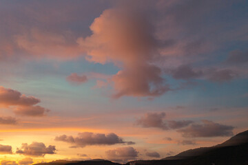 exotic pink red sky in sunset at Karon beach Phuket..Scene of colorful romantic sky sunset with changing the brilliant yellow sky gradually turned red. .beautiful sky of sunset in nature and travel 