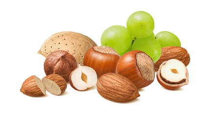 Hazelnuts, almonds in shell and green grapes isolated on white background. Fruit and nut mix