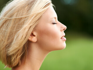 Woman, breathing and peace in nature, calm and zen for inner wellness, spiritual and meditation. Person, mindfulness and serenity in countryside, free and healing for mental health, mindset and soul