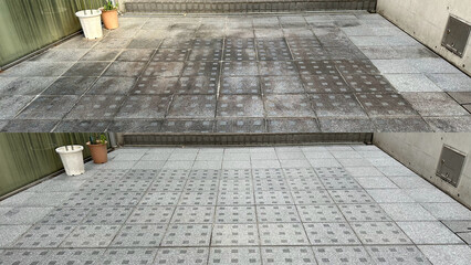 Before and after, cleaning on an old external natural granite floor