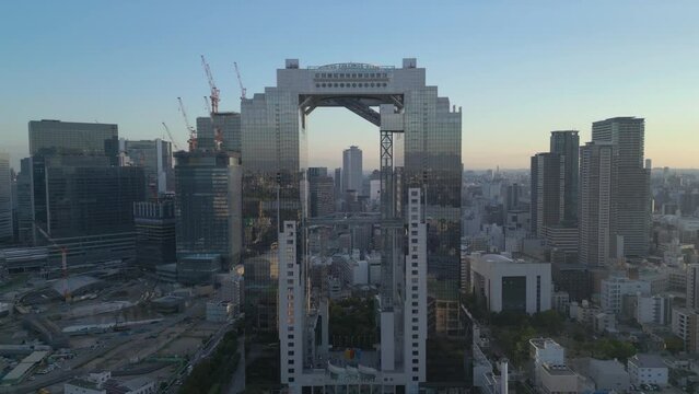 wide flying right view of Umeda Sky Building in Osaka Japan