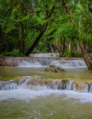 Fototapeta premium a beautiful deep forest waterfall in Thailand. Erawan Waterfall in National Park