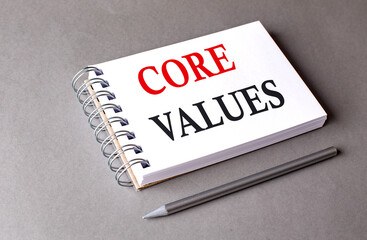 CORE VALUES word on notebook on grey background