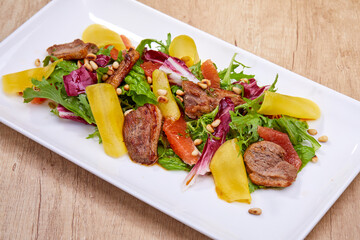 meat with roasted vegetables and sauce