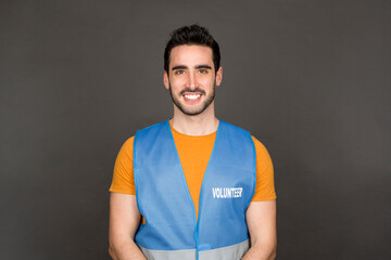 portrait smiling young volunteer man looking at camera