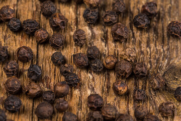 black pepper on wooden table