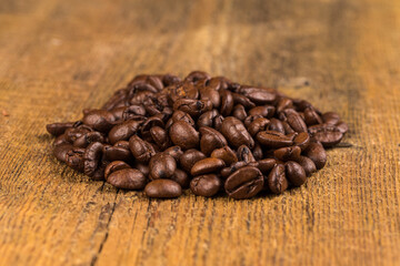 Coffee beans on grunge wooden background