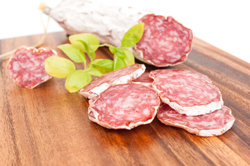 sliced salami on white background