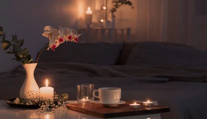 Foto auf Acrylglas night interior of bedroom with flowers and burning candles © Maya Kruchancova