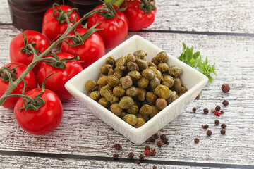 Marinated green capers in the bowl