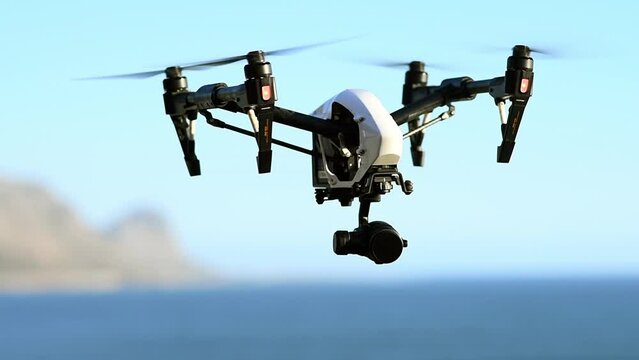 Drone, camera and flight of photography technology at the beach filming sea landscape with water or mountain. Remote control, device or recording videography surveillance of ocean, nature or blue sky