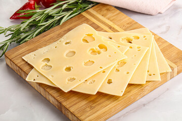 Sliced maasdam cheese with holes