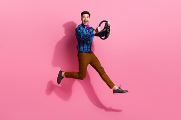 Fototapeta na wymiar Full length photo of jump driver gentleman learning how to use steering wheel new tesla plaid automobile isolated on pink color background
