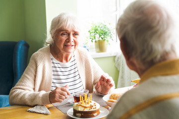 Happy old couple at home