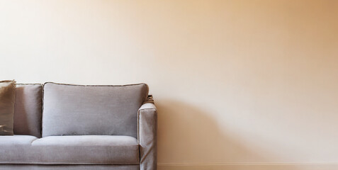 living room interior wall mockup in warm tones with sofa on empty wall background 