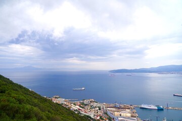 view over the roofs of Gibraltar to the Bay of Gibraltar and the Strait of Gibraltar with Morocco...