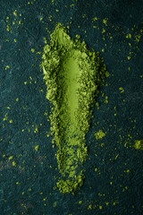 matcha powder tea on a stone surface