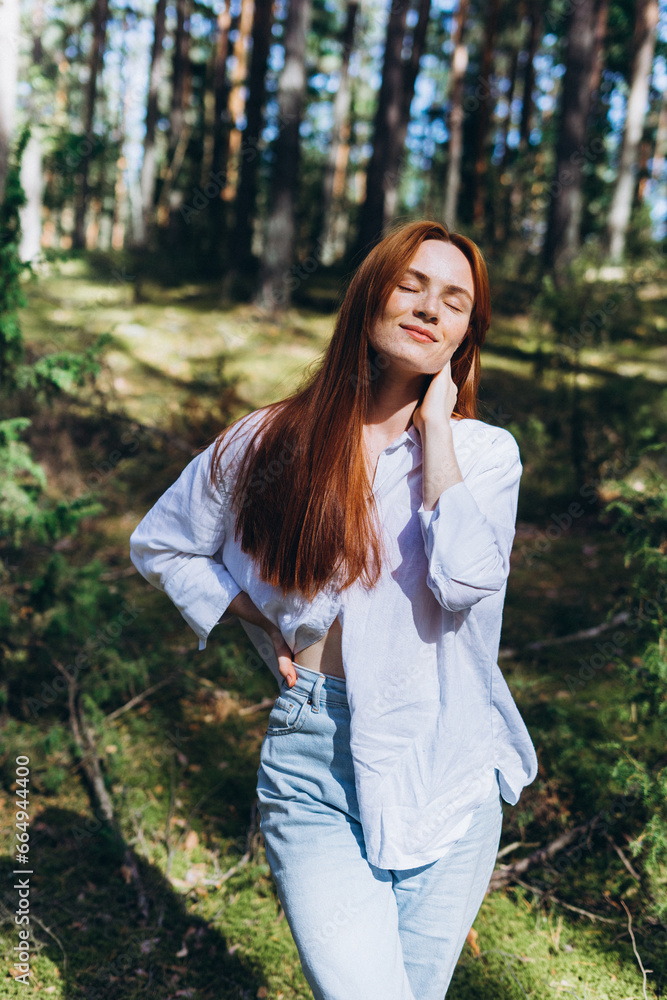 Wall mural Beautiful woman natural face freckles casual female portrait lifestyle beauty girl. Outdoor girl portrait in green summer forest