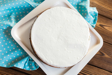 Sugar dessert, cake with cream and chocolate. Holiday baking. Homemade pastry