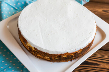 Sugar dessert, cake with cream and chocolate. Holiday baking. Homemade pastry