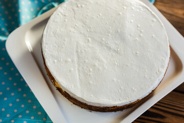 Sugar dessert, cake with cream and chocolate. Holiday baking. Homemade pastry