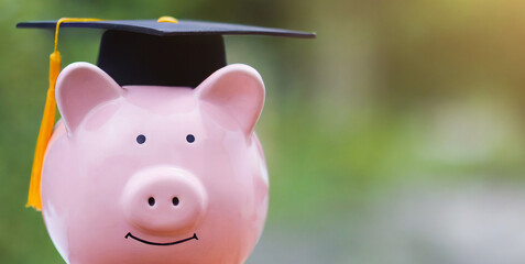 pink piggy bank with cap for education investment 