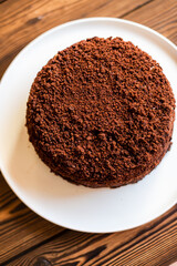 Sugar dessert, cake with cream and chocolate. Holiday baking. Homemade pastry