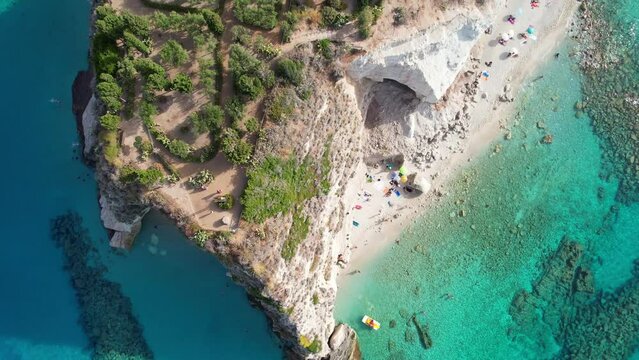Tropea - Italy - opening aerial view vertically down over the Byzantine pilgrimage church from the steen rock of the bathing beach to the old town