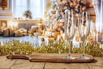 Desk of free space and New Year time champagne with two glasses. 
