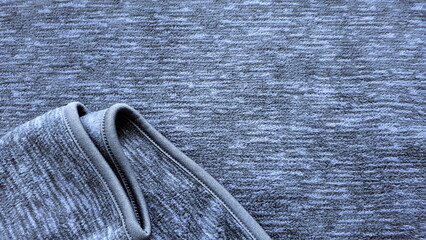 Gray-blue pile fleece fabric. Texture of warm fabric. Winter clothes. Fleece, polyester. Melange. © tetyanatr