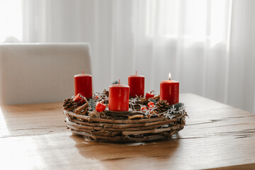 Cozy modern home with advent wreath on wooden dining table. Celebrating winter time and days before...