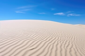 Fototapeta na wymiar white sand dune under a clear sky