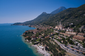 Coastline of the resort town of Gargnano Lake Garda Italy. The city is located on the shores of Lake Garda. Aerial panorama of Gargnano city located on Lake Garda Italy