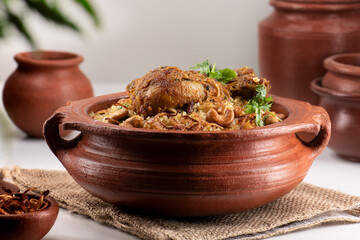 Delicious chicken biryani in traditional clay pot