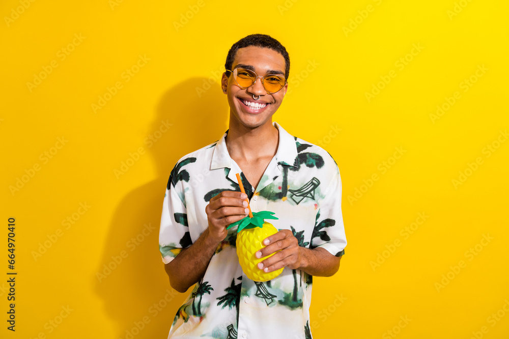 Sticker photo of cheerful guy dressed stylish clothes hands hold tasty cocktail enjoy summer relax chill iso