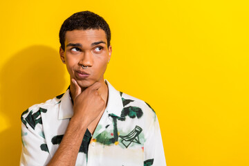 Photo of intelligent puzzled man with nose piercing dressed print shirt touch chin look empty space...