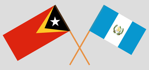 Crossed flags of East Timor and Guatemala. Official colors. Correct proportion