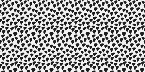 Black specks, texture of repeating spotted surface. For print, background, wallpaper, seamless surface, pillows, notebooks.