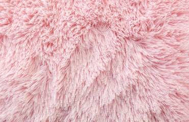 Pink wool texture background. Natural fluffy fur sheep wool skin texture. for background and...