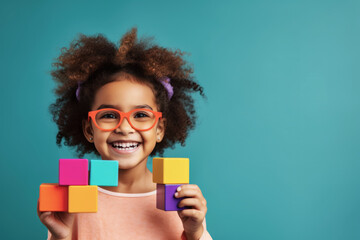 African American Kid girl playing with colorful toy blocks