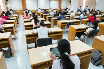 Selective focus high school or university students concentrate on language listening test in the...