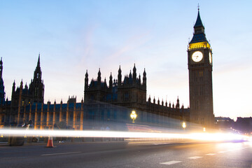 Big Ben, Parliament, and Westminster bridge with car lights at dusk, in London, the UK