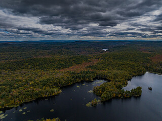 Aerial view of the countryside in Stormville, NY on a cloudy day during the colorful autumn season...